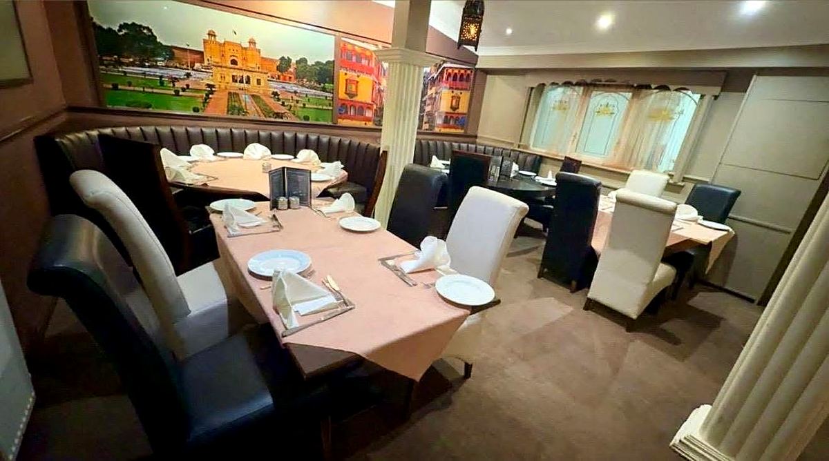 Dining booths and Indian city murals inside Buraq, Kirkham