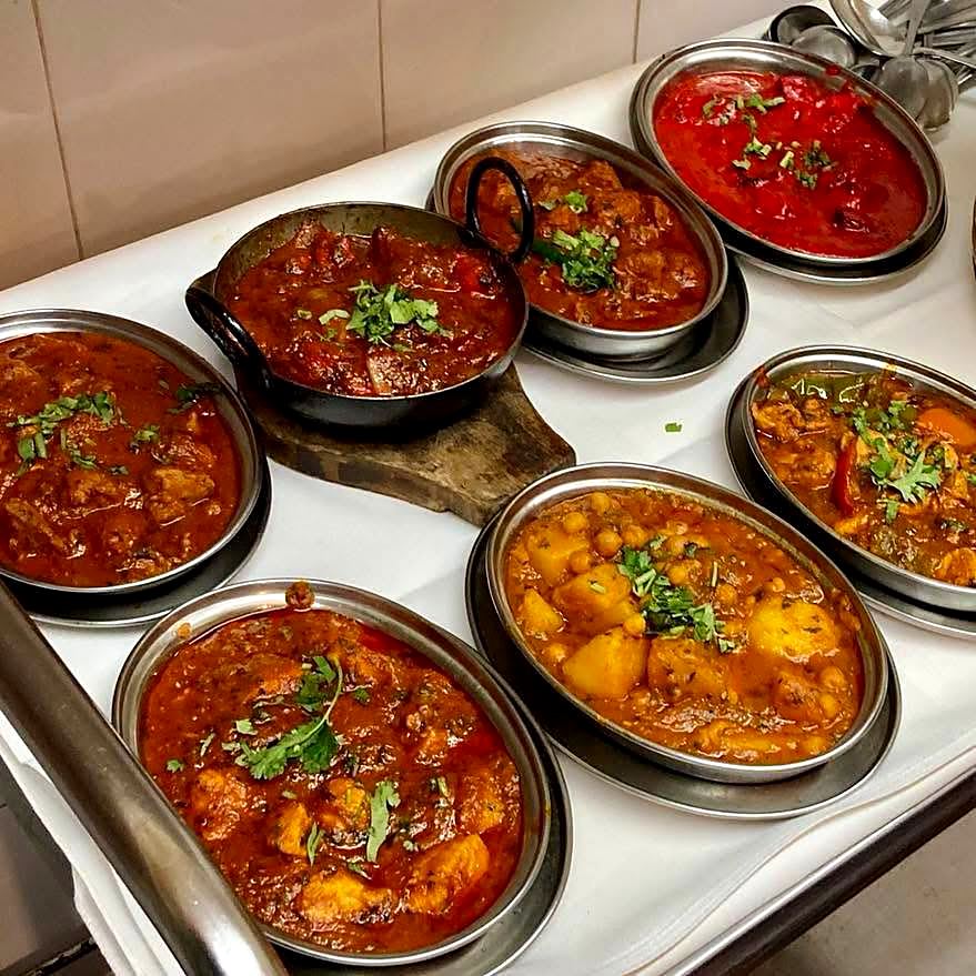 A selection of curries served in balti bowls at Buraq